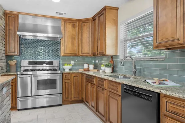 a kitchen with a sink stove and cabinets