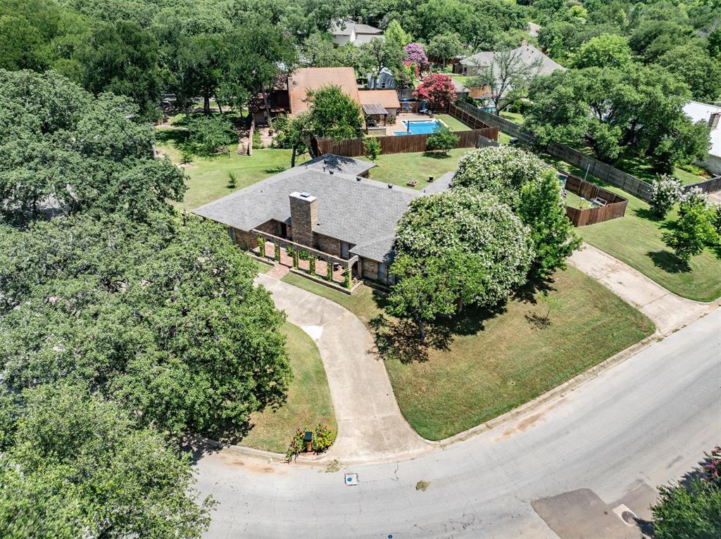 2016 Pembrooke Place Denton, TX 76205 - Photo 5 of 40 an aerial view of a house with a yard and greenery