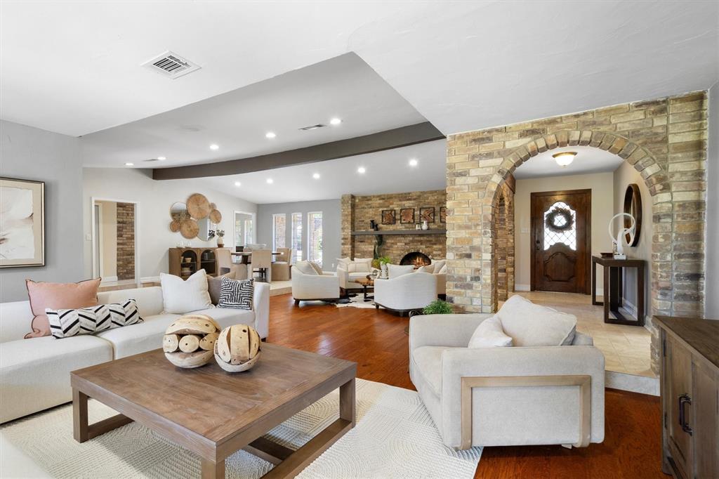 2016 Pembrooke Place Denton, TX 76205 - Photo 9 of 40 a living room with furniture and a wooden floor