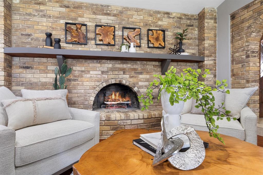 2016 Pembrooke Place Denton, TX 76205 - Photo 10 of 40 a living room with furniture and a fireplace
