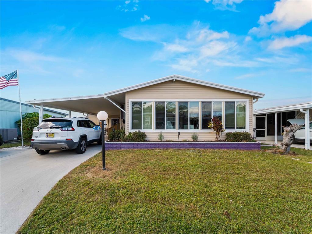 154 Rarotonga Road North Port, FL 34287 - Photo 1 of 47 a view of a house with swimming pool and porch