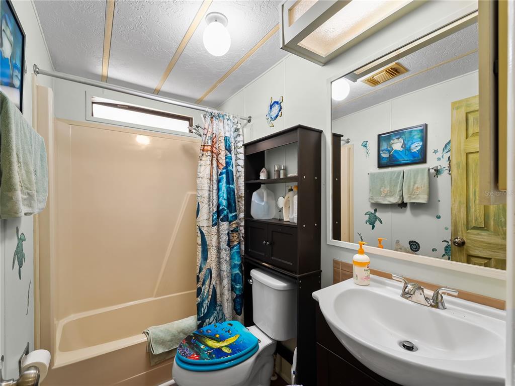 154 Rarotonga Road North Port, FL 34287 - Photo 18 of 47 a bathroom with a sink and a mirror