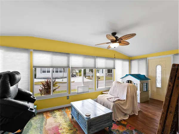 a living room with furniture and a table