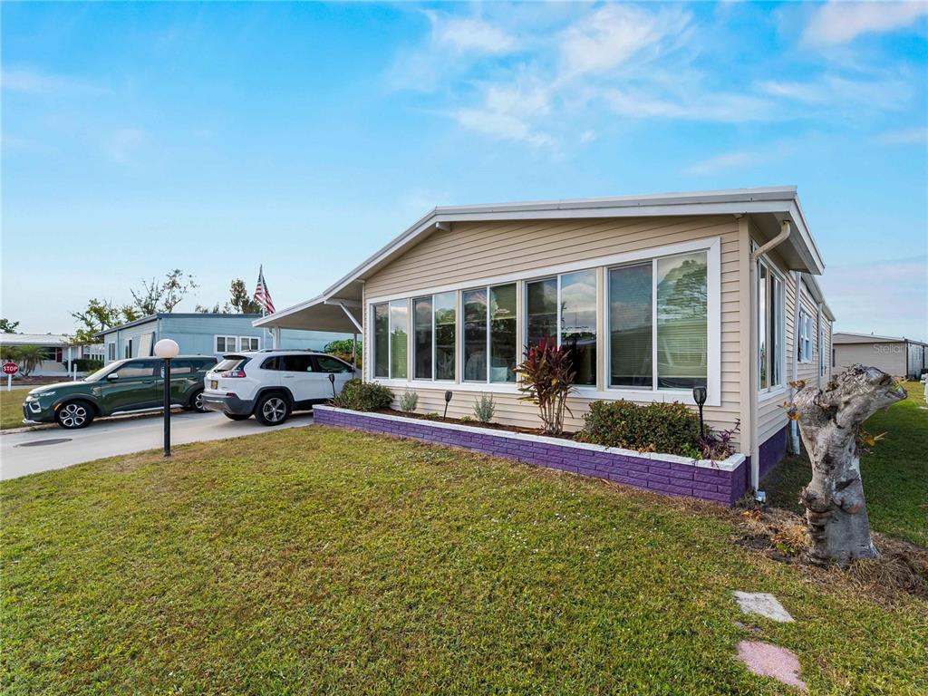 154 Rarotonga Road North Port, FL 34287 - Photo 28 of 47 a view of a house with swimming pool and sitting area