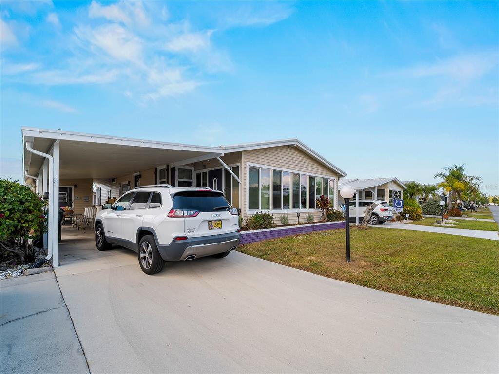 154 Rarotonga Road North Port, FL 34287 - Photo 29 of 47 a front view of a house with garden