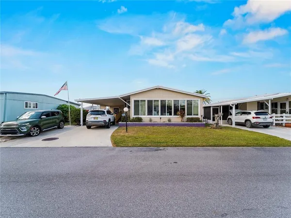 swimming pool view with a seating space