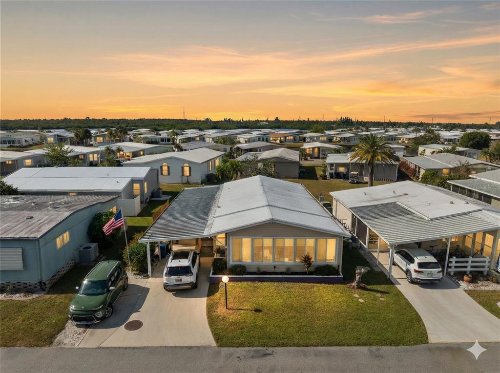 154 Rarotonga Road North Port, FL 34287 - Photo 44 of 47 a city view with large buildings and cars parked