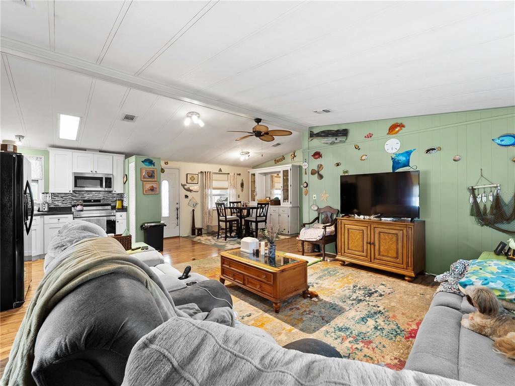 154 Rarotonga Road North Port, FL 34287 - Photo 9 of 47 a living room with furniture and a flat screen tv