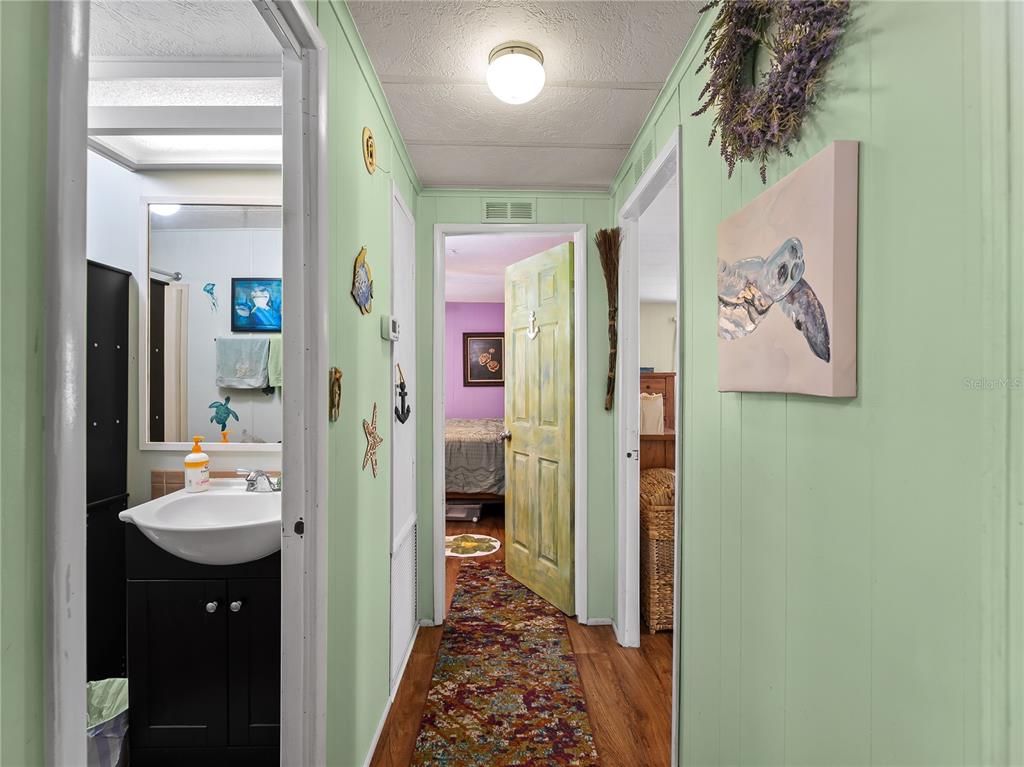 154 Rarotonga Road North Port, FL 34287 - Photo 10 of 47 a bathroom with a sink and a mirror