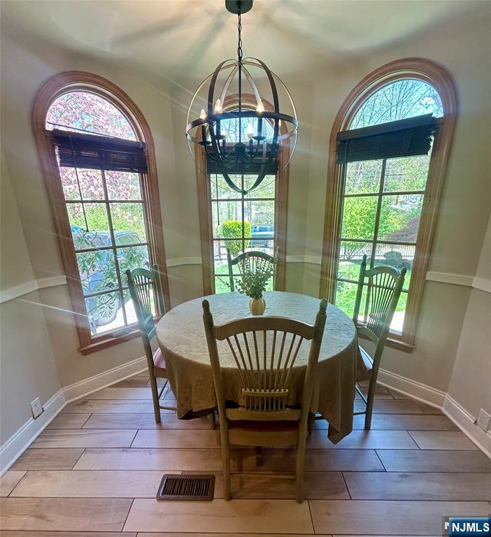 157 West Glen Road Denville, NJ 07834 - Photo 13 of 45 a view of a dining room with furniture window and wooden floor