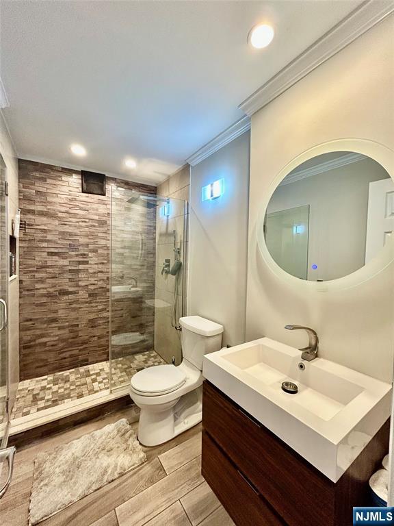 157 West Glen Road Denville, NJ 07834 - Photo 22 of 45 a bathroom with a sink mirror toilet and shower