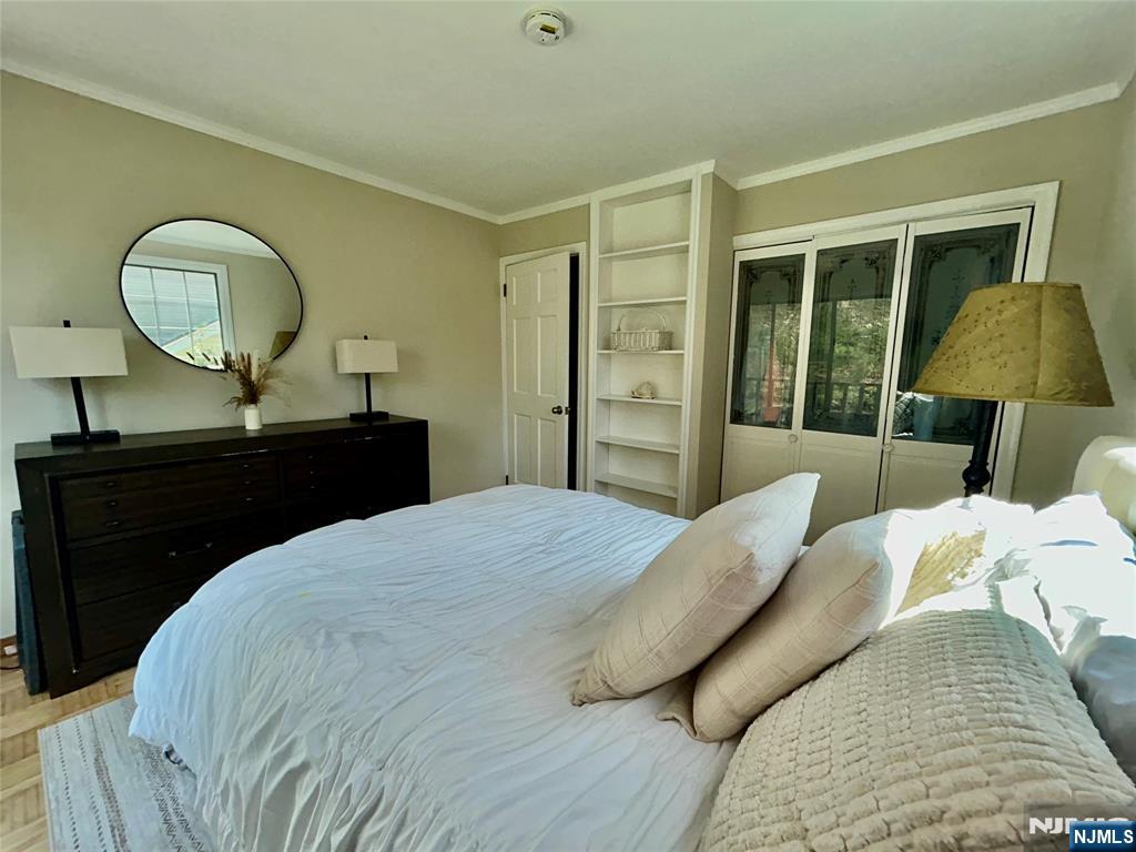 157 West Glen Road Denville, NJ 07834 - Photo 35 of 45 a bedroom with a bed and a dresser