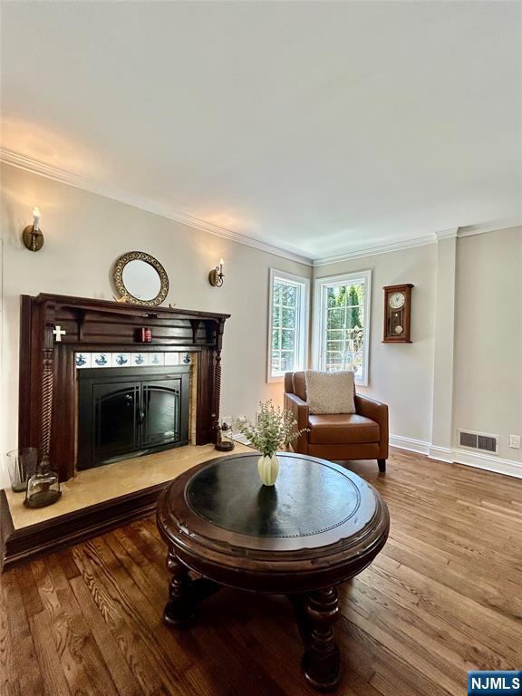 157 West Glen Road Denville, NJ 07834 - Photo 8 of 45 a living room with furniture a fireplace and a table