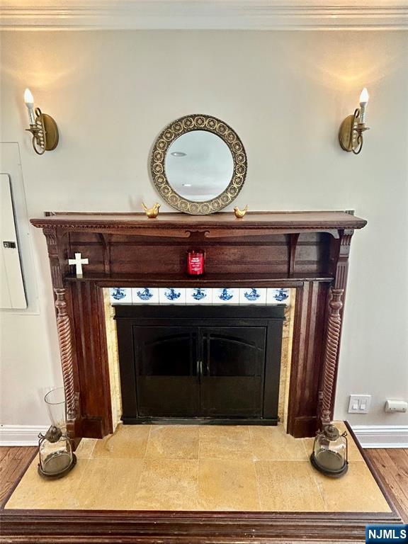 157 West Glen Road Denville, NJ 07834 - Photo 9 of 45 a living room with a fireplace and a wooden floor