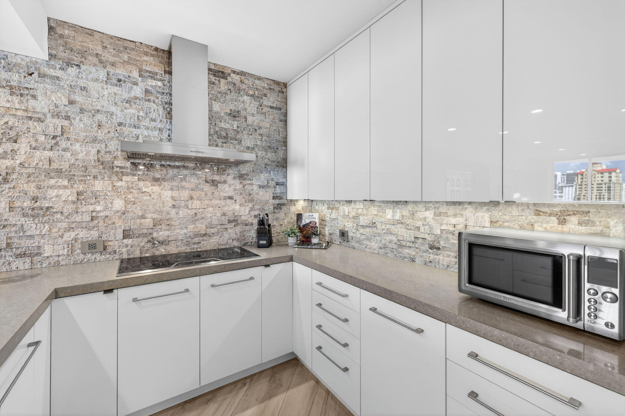 100 South Birch Road, Unit 803 Fort Lauderdale, FL 33316 - Photo 11 of 57 a kitchen with stainless steel appliances white cabinets and a sink