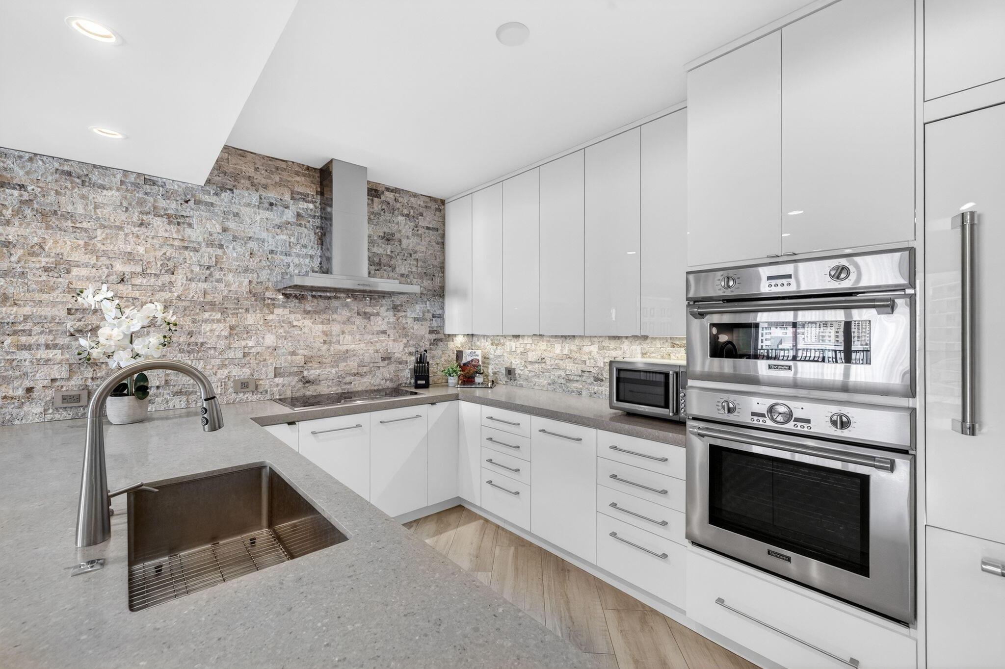 100 South Birch Road, Unit 803 Fort Lauderdale, FL 33316 - Photo 12 of 57 a kitchen with cabinets appliances and a sink
