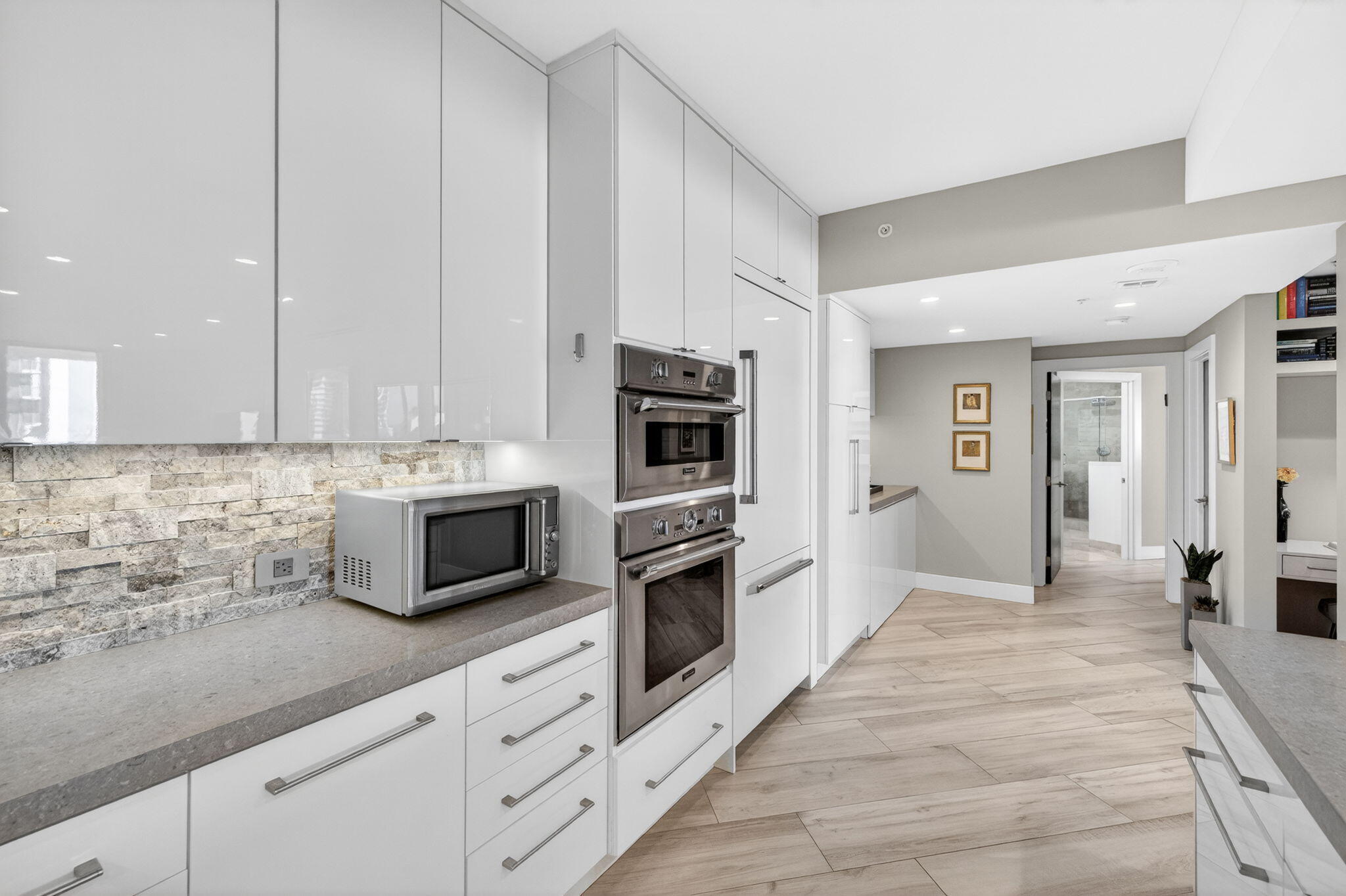 100 South Birch Road, Unit 803 Fort Lauderdale, FL 33316 - Photo 14 of 57 a kitchen with granite countertop white cabinets and stainless steel appliances