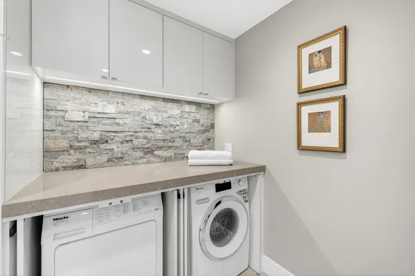a utility room with dryer and washer