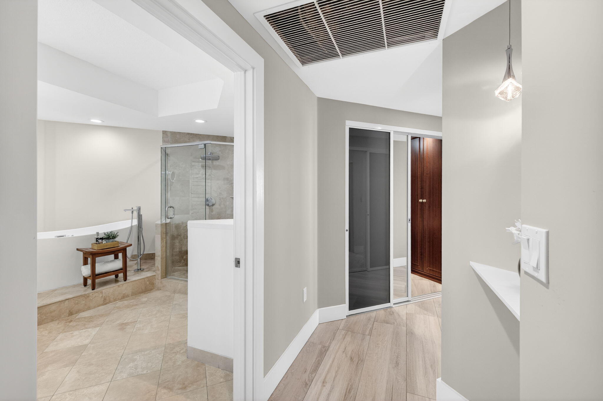 100 South Birch Road, Unit 803 Fort Lauderdale, FL 33316 - Photo 17 of 57 a view of a hallway with wooden floor and a bathroom