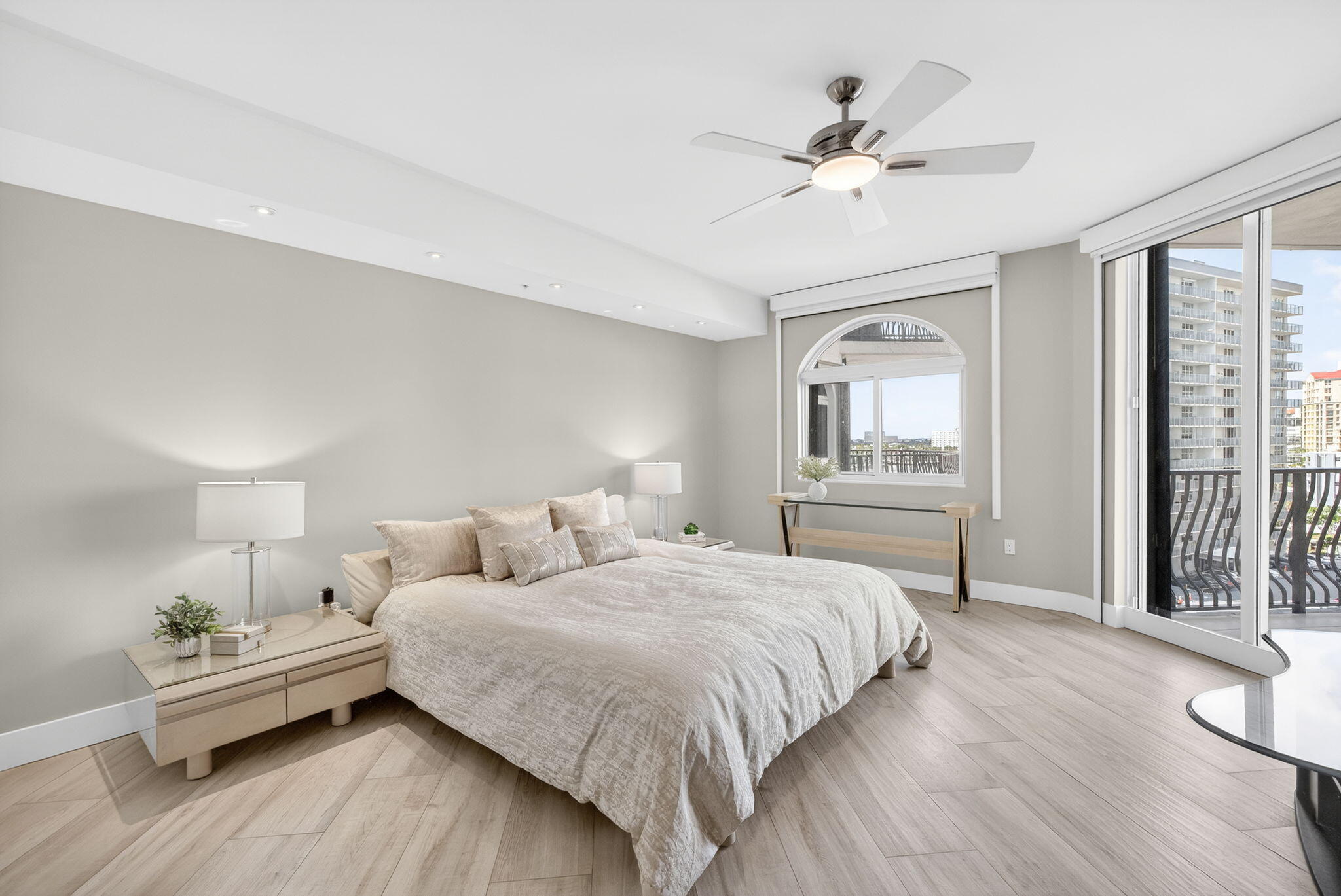 100 South Birch Road, Unit 803 Fort Lauderdale, FL 33316 - Photo 19 of 57 a bedroom with a bed and a chandelier