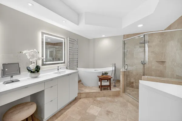a white bath tub sitting in a bathroom