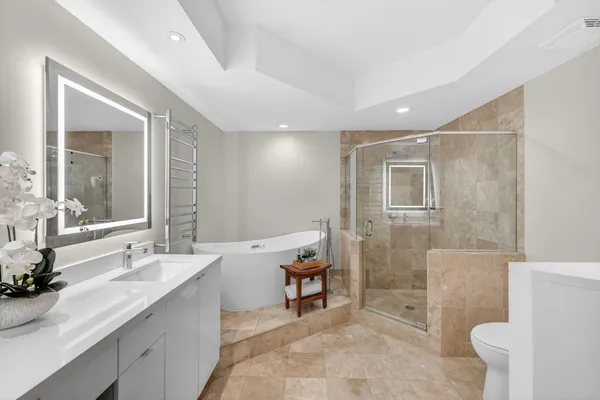 a bathroom with a double vanity sink mirror and