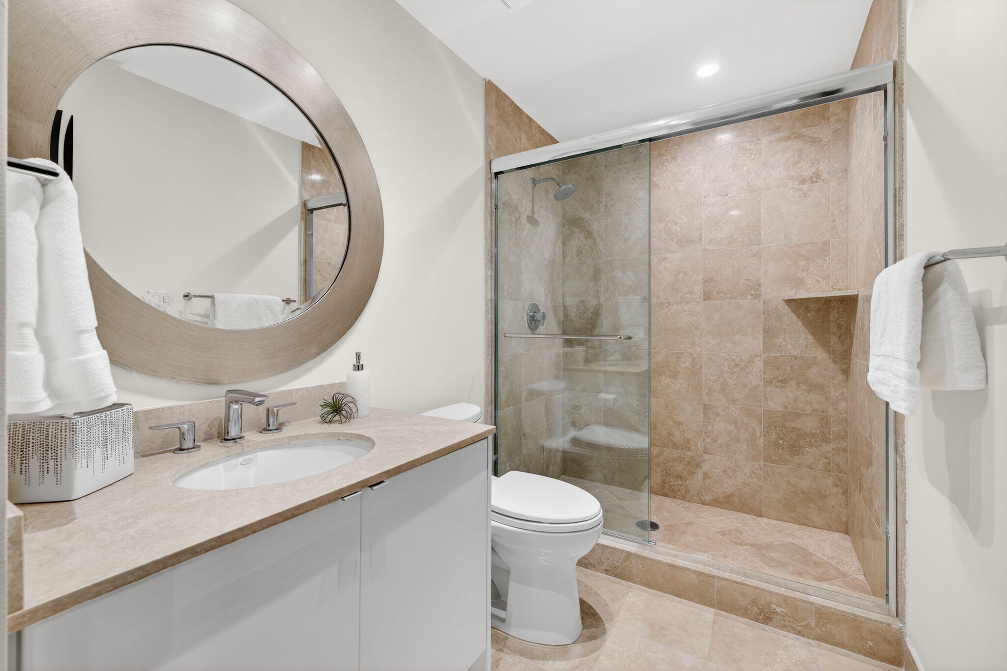 100 South Birch Road, Unit 803 Fort Lauderdale, FL 33316 - Photo 34 of 57 a bathroom with a sink a toilet and a mirror