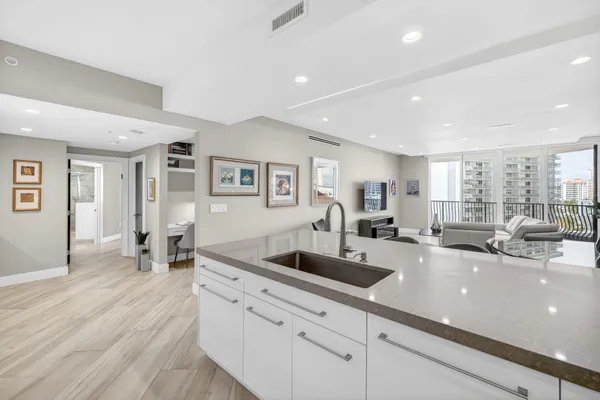 a large room with lots of counter space and furniture