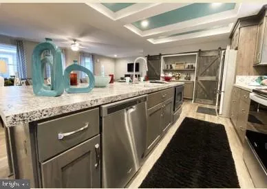 a kitchen with a stove and a sink