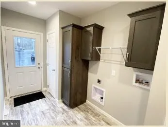 a view of a livingroom with furniture and floor to ceiling window