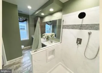 a bathroom with a sink and mirror