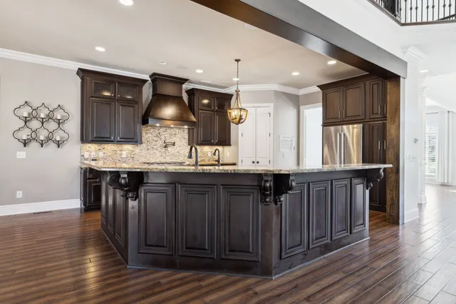 a kitchen with a sink stove and cabinets