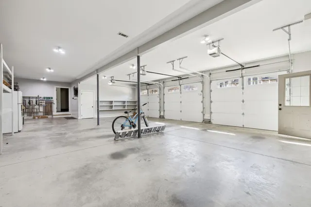 a view of a house with a big yard and large trees