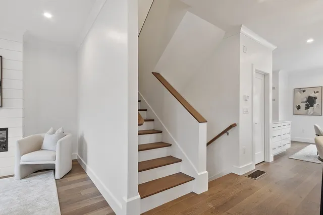 a view of a livingroom with stairs and a living room