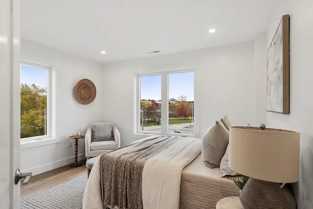 a bedroom with a bed and window