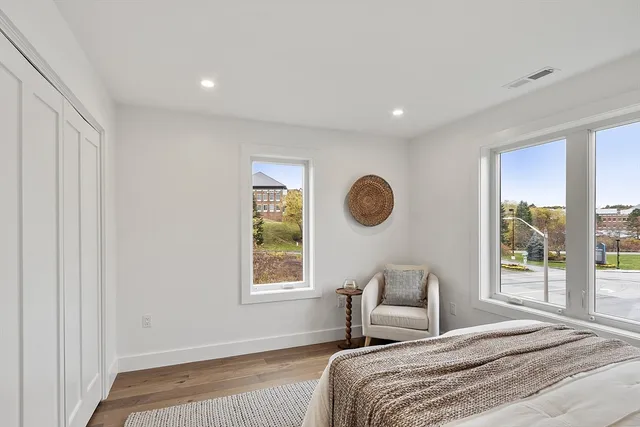 a bedroom with a large bed and a window