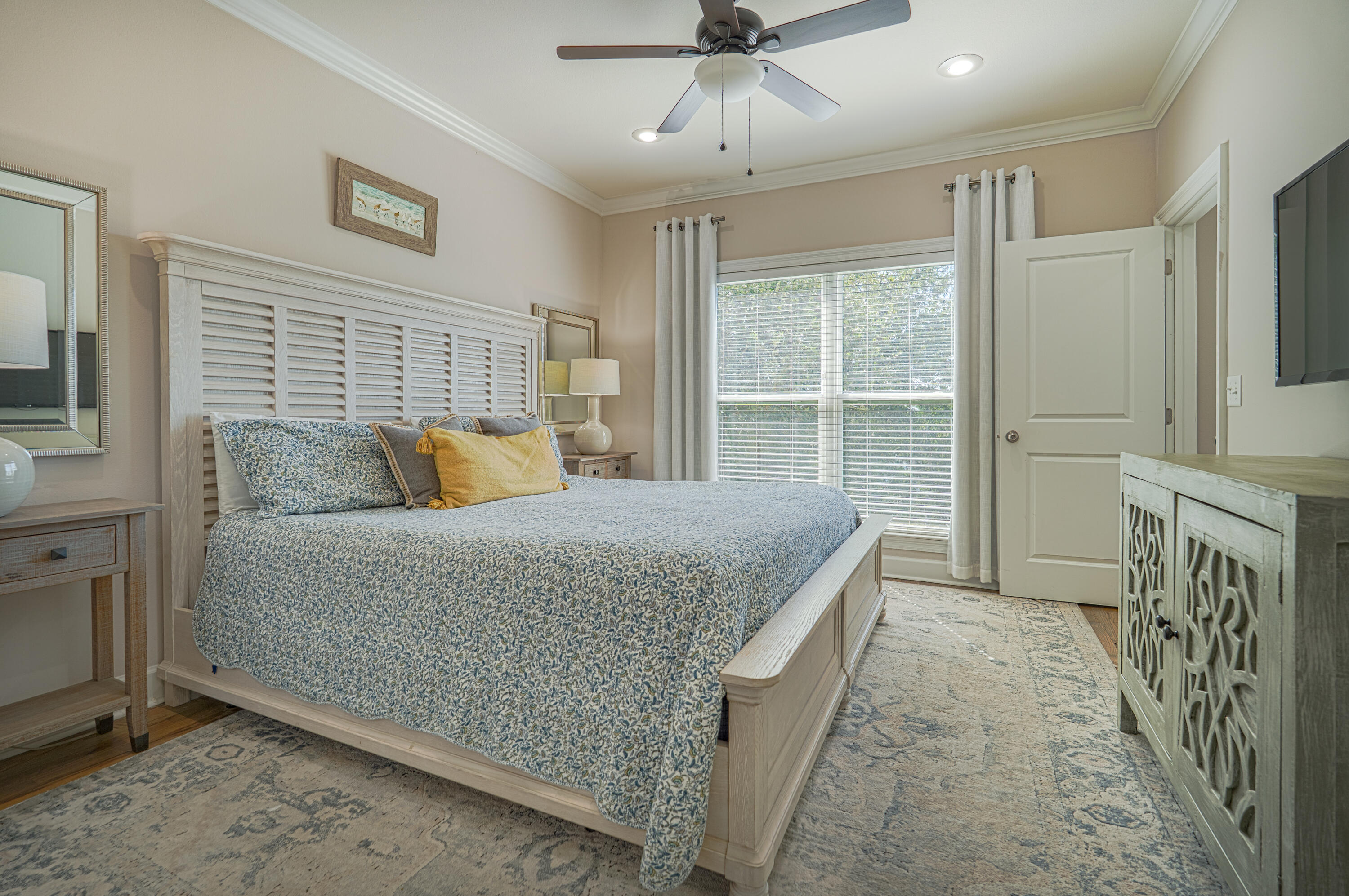 257 Driftwood Road, Unit 1 Miramar Beach, FL 32550 - Photo 11 of 36 a bedroom with a bed and ceiling fan