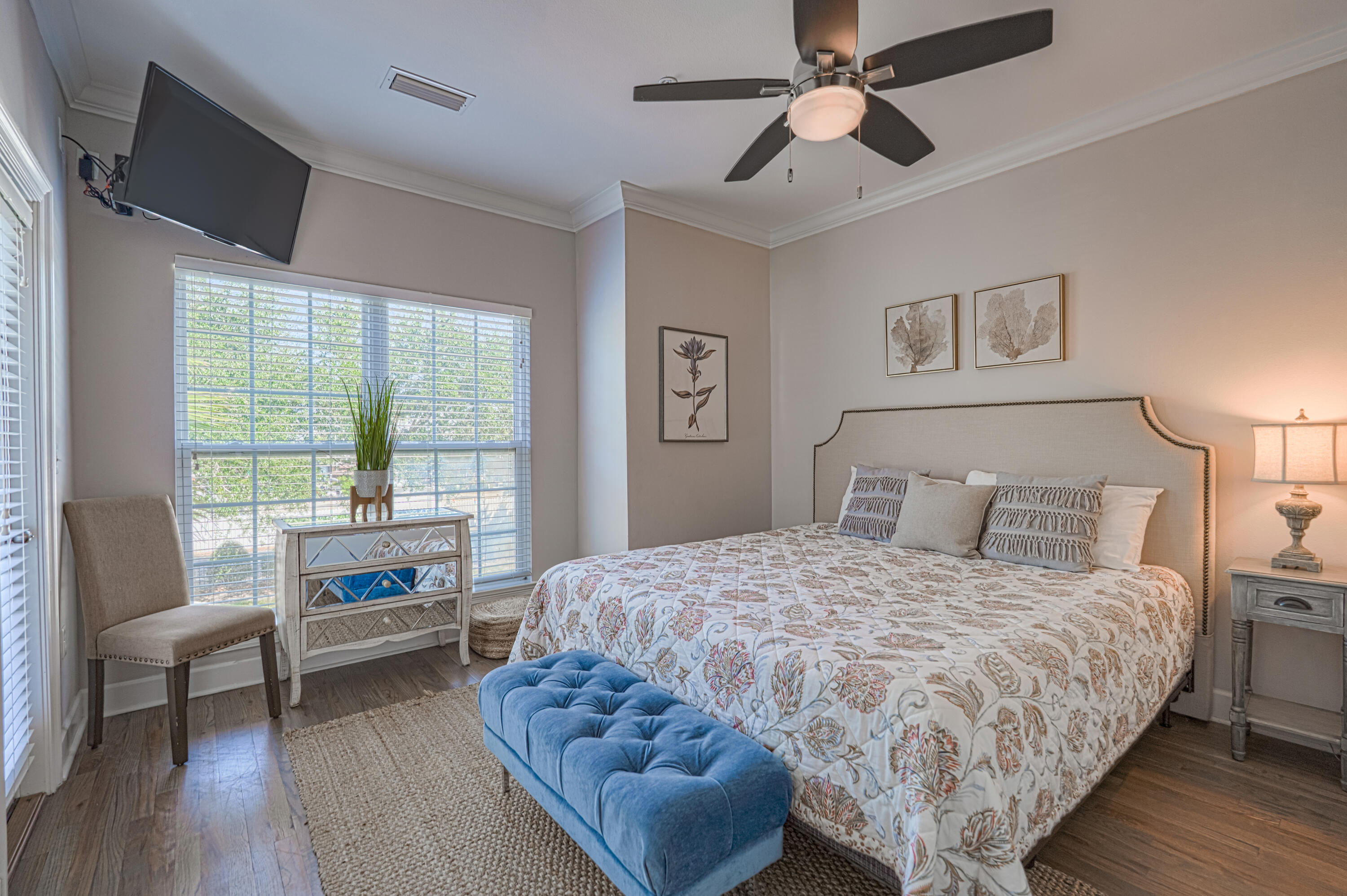 257 Driftwood Road, Unit 1 Miramar Beach, FL 32550 - Photo 19 of 36 a bedroom with a bed a couch and a chandelier