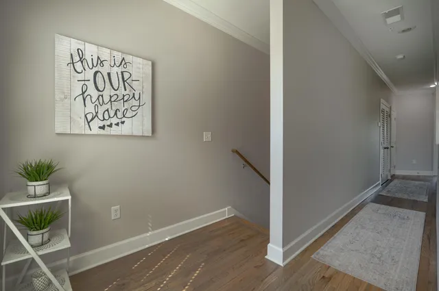 a view of a hallway with stairs
