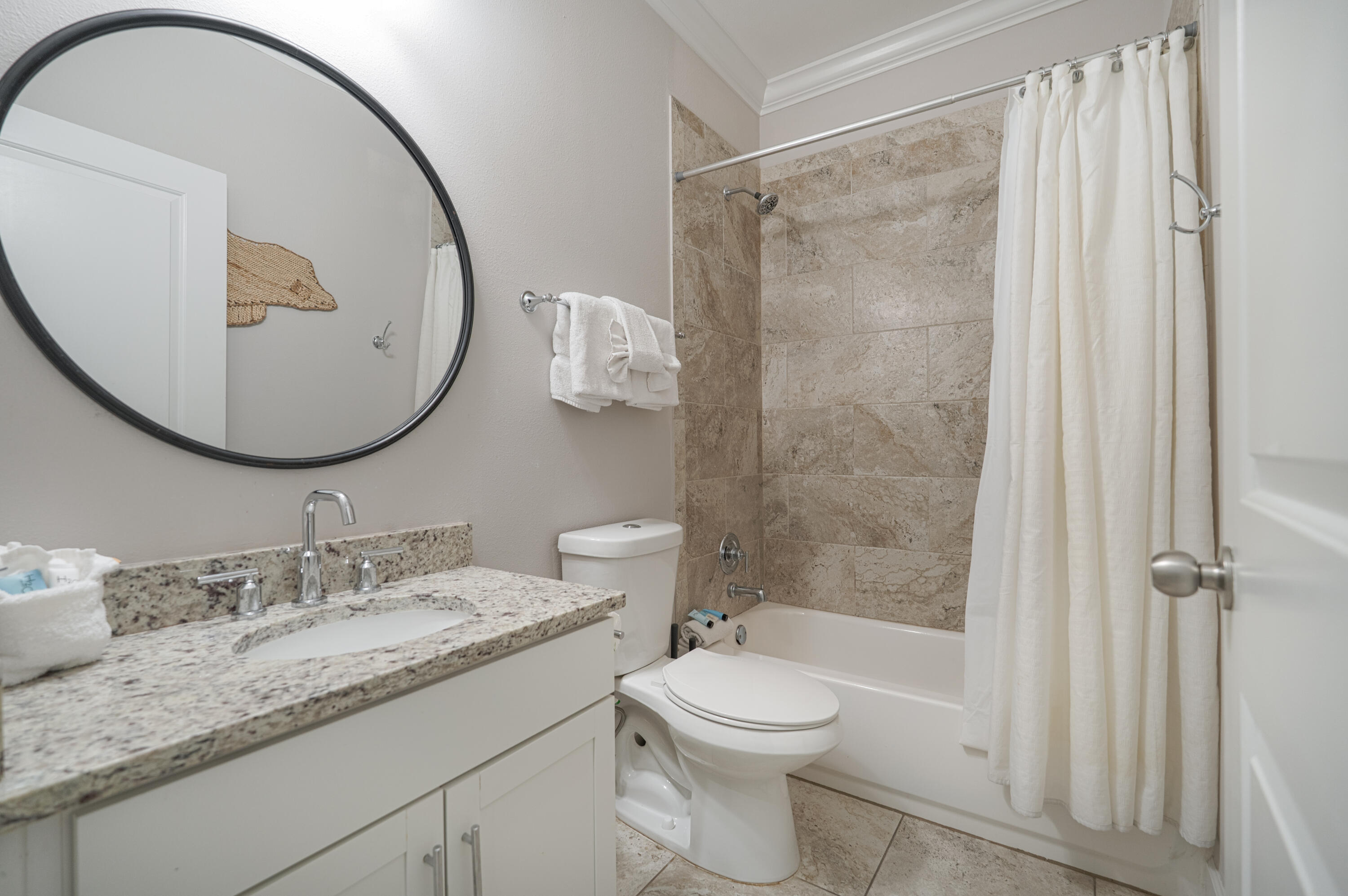 257 Driftwood Road, Unit 1 Miramar Beach, FL 32550 - Photo 29 of 36 a bathroom with a granite countertop sink toilet and shower