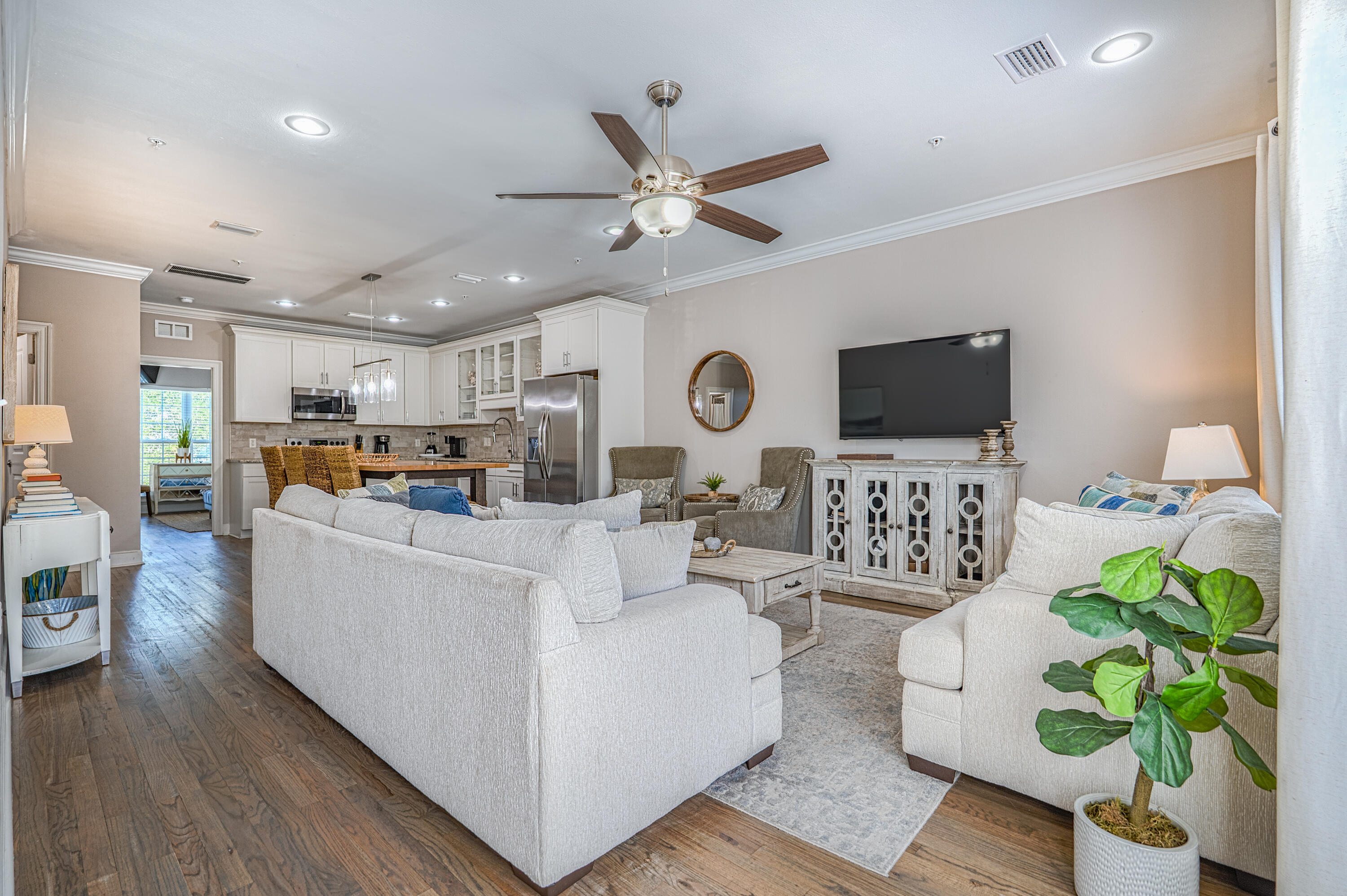 257 Driftwood Road, Unit 1 Miramar Beach, FL 32550 - Photo 5 of 36 a living room with furniture and a flat screen tv