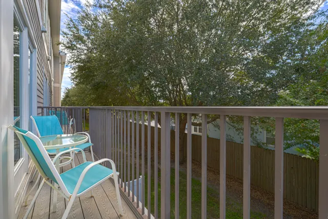 a view of a chair and table in the balcony