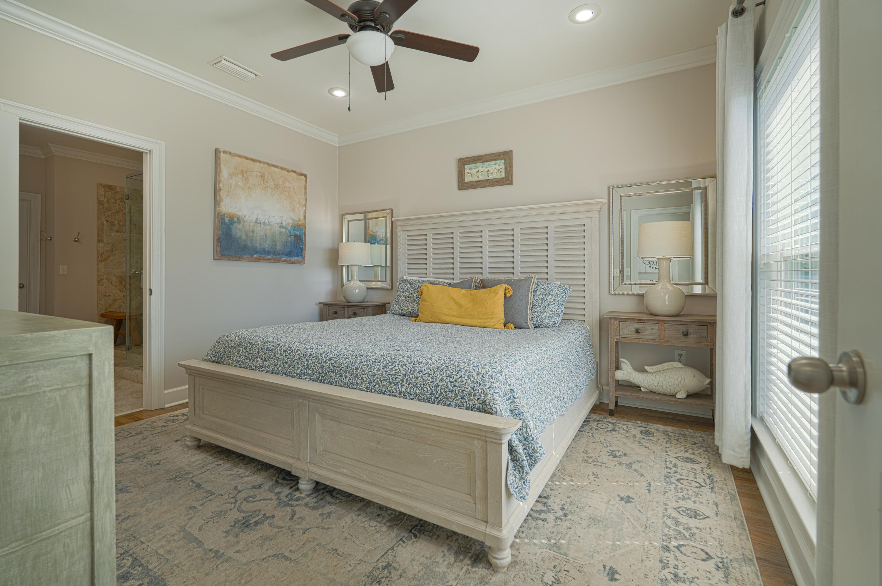 257 Driftwood Road, Unit 1 Miramar Beach, FL 32550 - Photo 10 of 36 a spacious bedroom with a bed and a chandelier