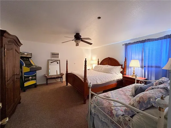 a bedroom with a bed and furniture