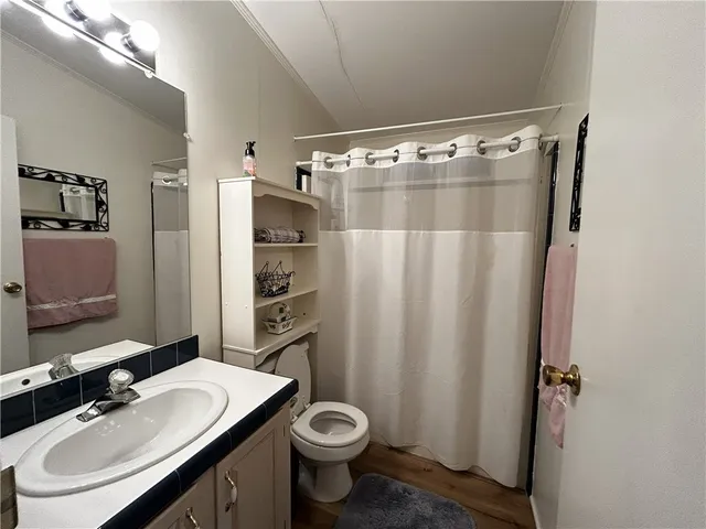 a bed room with a bed and a lamp