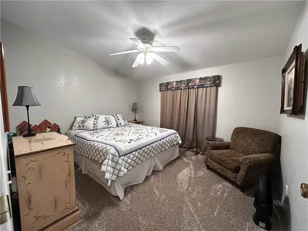 a bed room with a bed and a lamp