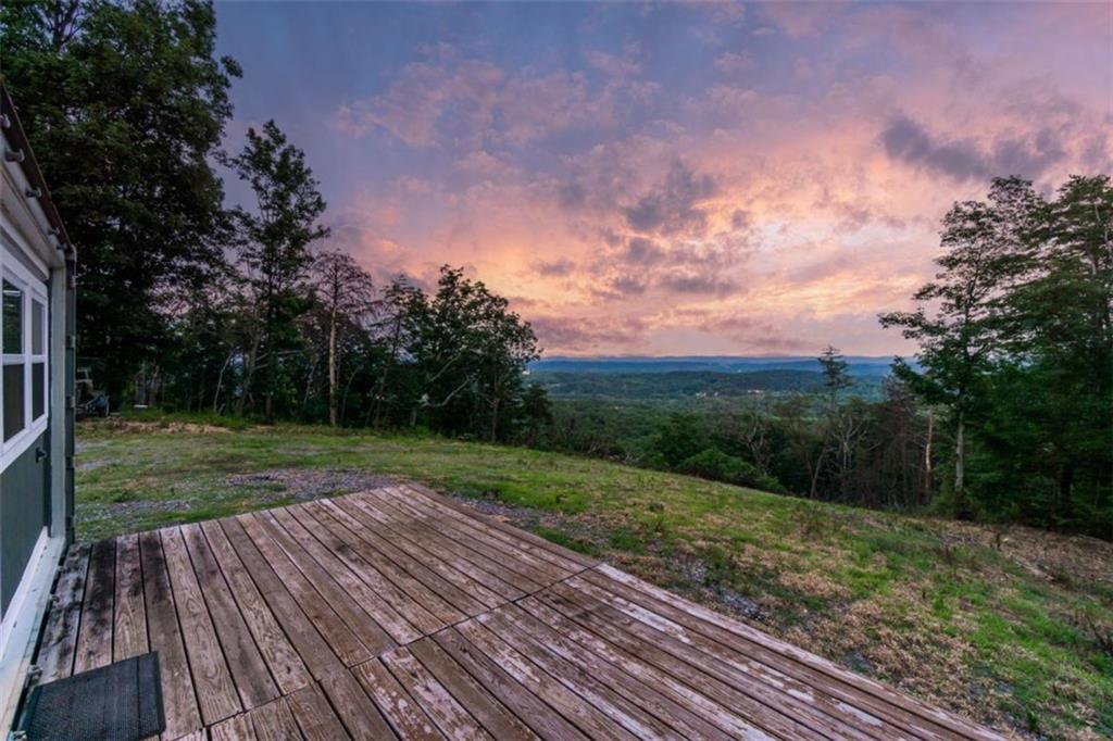 2400 Shinbone Ridge Road LaFayette, GA 30728 - Photo 23 of 29 a view of a backyard with wooden floor and large trees
