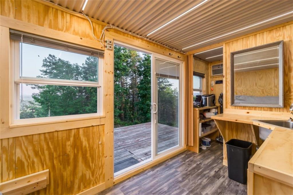 2400 Shinbone Ridge Road LaFayette, GA 30728 - Photo 6 of 29 a view of a room with wooden floor and iron stairs