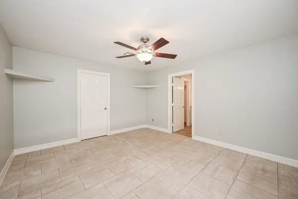 a view of a closet with racks on the wall