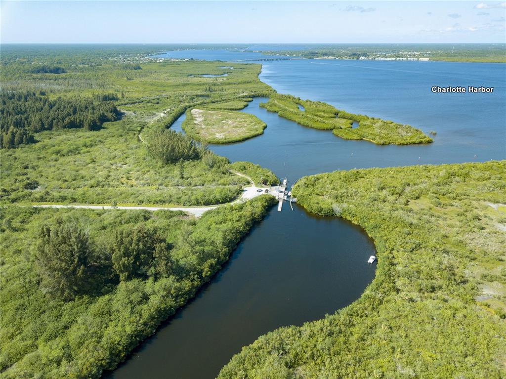 8104 Norton Road Port Charlotte, FL 33981 - Photo 7 of 8 a view of a lake with a mountain
